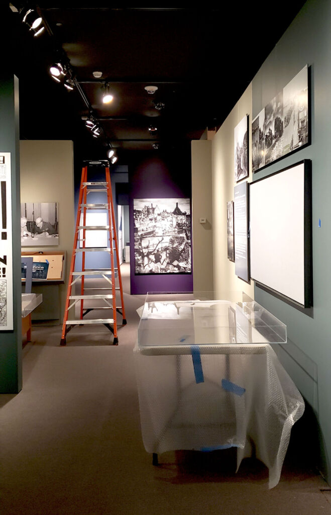 Installation in progress at museum with ladder.