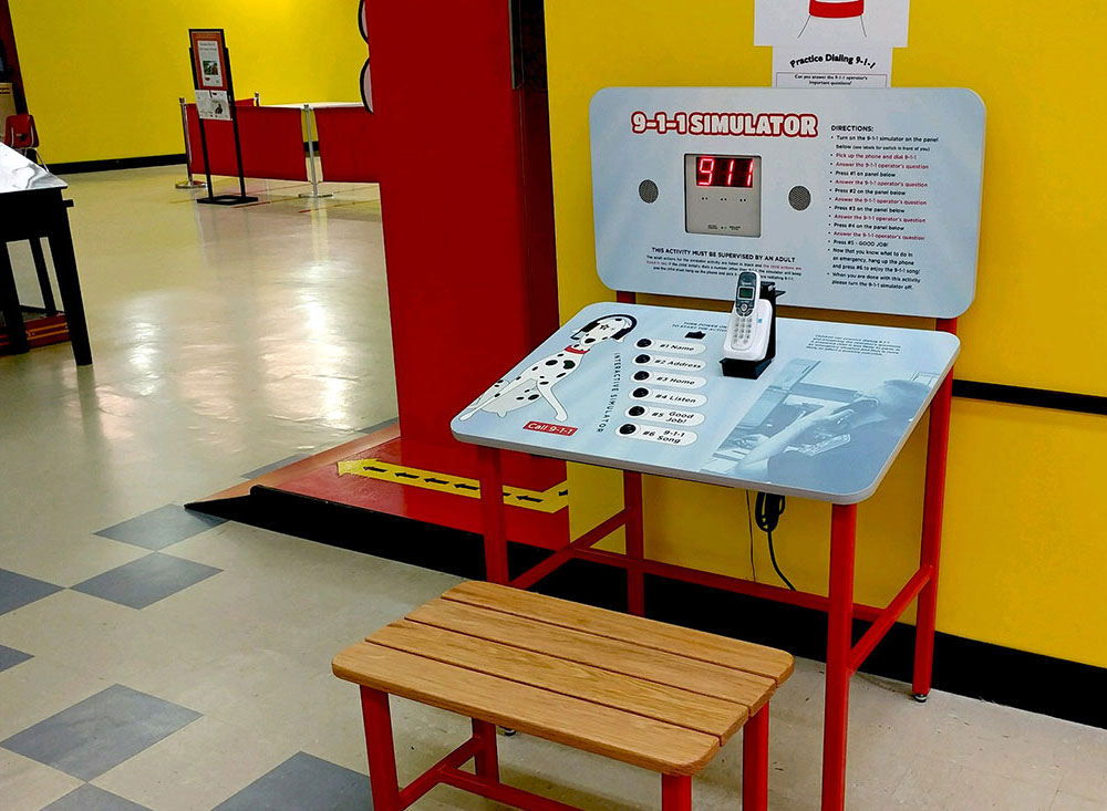 Firefighting kiosk in blue and red for educational museum display