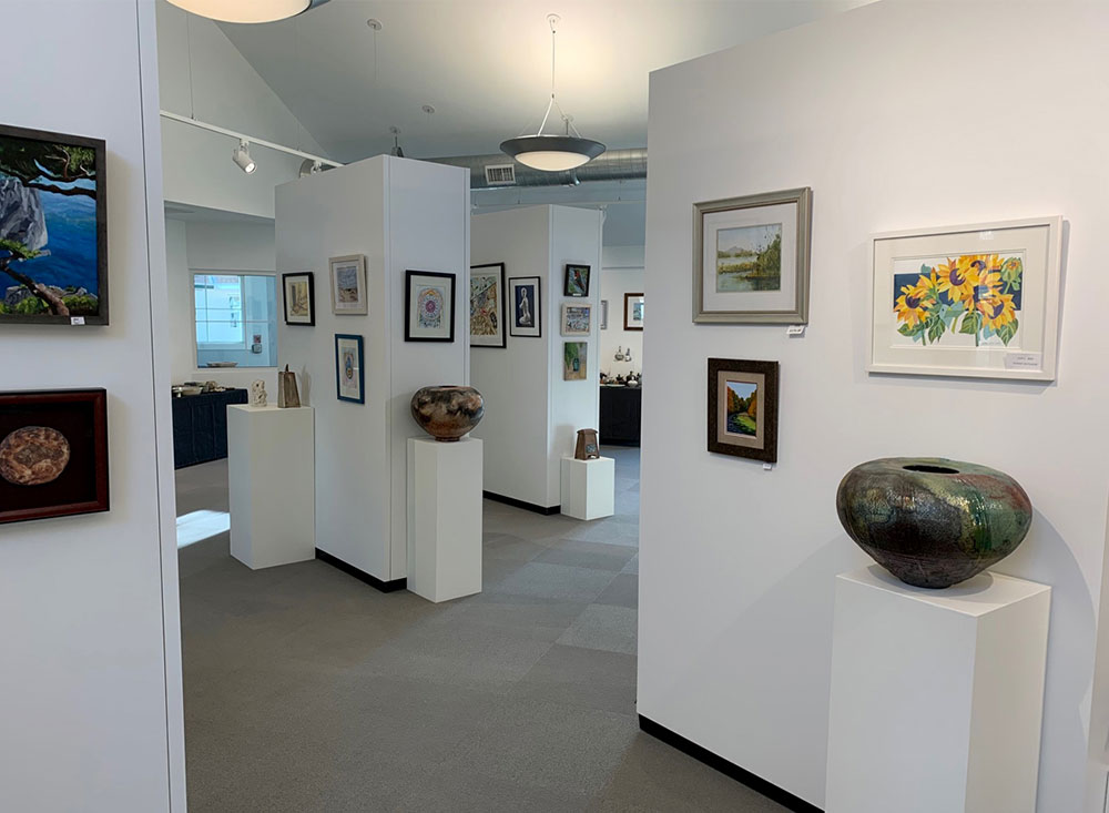 Rental Walls and pedestals with hanging art and pottery displays at Monmouth County