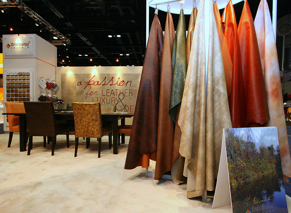 Trade show exhibit booth with seating and sample racks for Townsend Leather